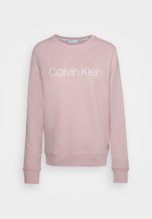 Felpa rosa chiaro realizzata in cotone misto, con scollatura rotonda, maniche lunghe e logo bianco "Calvin Klein" sul frontale.