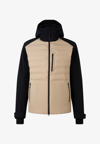 Béžová a námořnická zateplená bunda s kapsou na zip na hrudi, polstrovaným předním dílem a nastavovatelnými manžetami. Má vysoký límec a kapuci.