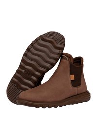 Stivali ankle in pelle marrone con pannelli laterali elastici, suola testurizzata e suola sagomata. Presenta una discreta etichetta con logo sul lato.