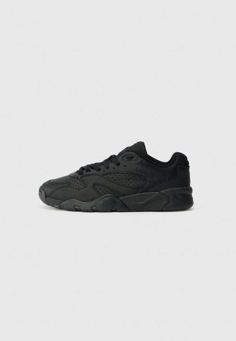 Black athletic shoe with a textured leather upper, perforations for breathability, and a sturdy rubber sole; low-profile design.