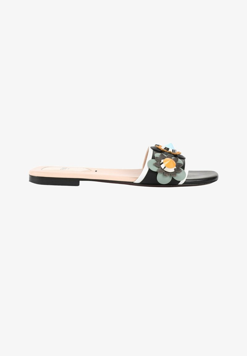 Sandale slide noire avec une semelle beige et des ornements décoratifs multicolores en forme de fleur sur la bride.