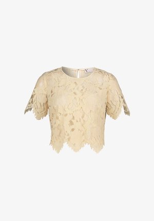Crop top en dentelle beige avec motifs floraux, manches courtes et ourlet ondulé. Comprend un détail de fermeture au dos.