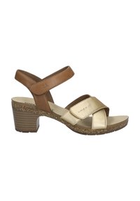 Bruine en gouden sandalen met hakken, voorzien van kruisbanden, een gestructureerde kurken tussenzool en een blokhak met een gestreept patroon. Gemaakt van leer.