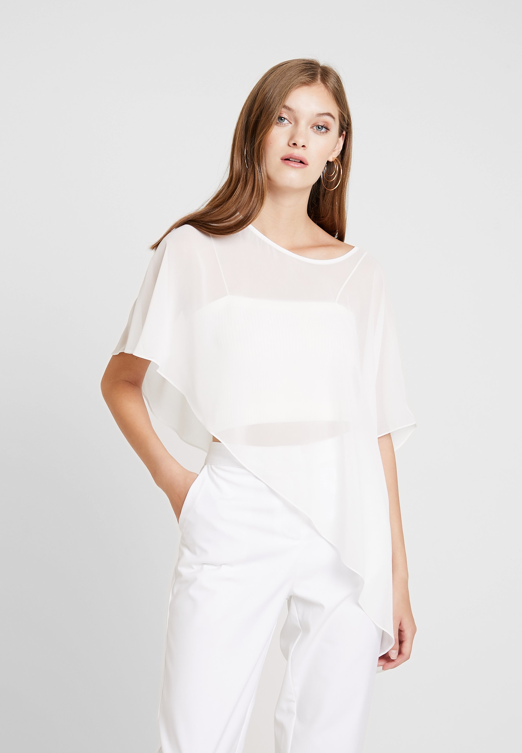 Swing Cape creme weiss Zalando.no Swing Cape - champagner