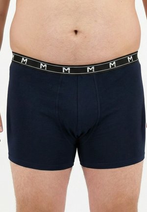 Tmavě modré boxerky s černým pasem zdobeným opakujícím se bílým logem. Hladká, pružná látka s přiléhavým střihem.