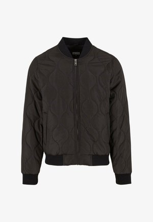 Black quilted bomber jacket with a ribbed collar, elastic cuffs, and waistband. Features a zip closure and smooth texture.