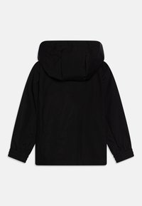 Veste noire à capuche avec des poignets élastiques, en tissu lisse et d'une coupe décontractée. La vue de dos montre un design simple sans embellissements.