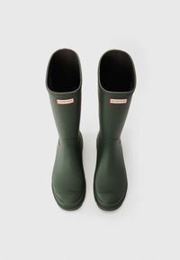 Green rubber rain boots with a smooth, shiny texture. Features a round toe, straight shaft, and a small red and white logo on the front.