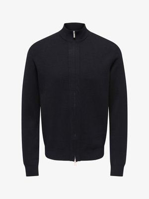 Marineblå genser med glidelås, høy krage, strikket stoff, lange ermer og glatt tekstur; har en sølvfarget glidelås foran og ribbestrikkede mansjetter.