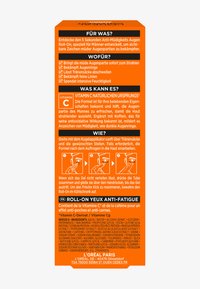 Emballage pour roll-on anti-fatigue pour les yeux, avec une couleur orange vif, du texte en allemand et en français, ainsi que des graphiques d'instructions. Contient de la vitamine C et de la caféine.
