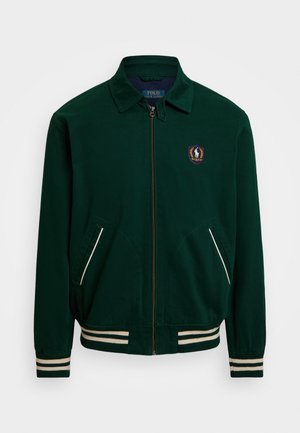 Veste zippée vert foncé avec poignets et ourlet rayés, deux poches obliques et un petit logo Polo Ralph Lauren sur la poitrine.