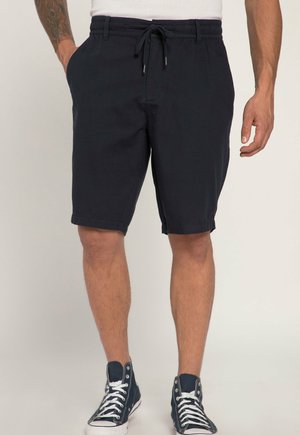 Mørkeblå shorts lavet af blødt stof, med en elastisk talje med snor, sidelommer og en knælængde.