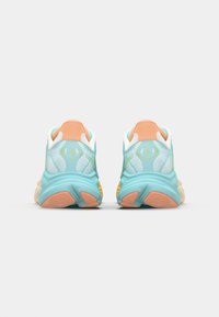 Light blue athletic shoes with mesh upper, orange heel tab, cushioning sole, and green accent detail near the heel. Back view shown.