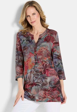 Langsleeve tuniek in meerkleurige bloem- en abstracte patronen, met een knopenlijst en een licht uitlopende zoom, gemaakt van een lichtgewicht stof.