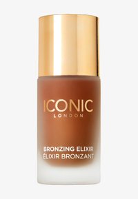 Botella de elixir bronceador con base esmerilada y tapa metálica dorada. Presenta "ICONIC LONDON" y "BRONZING ELIXIR" en texto blanco. Líquido de tono marrón visible.