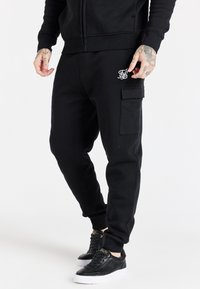 ESSENTIAL - Pantaloni sportivi - black