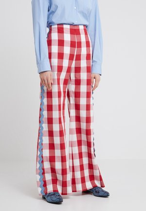 Rood en wit geruite wijdte broek met blauwe geschulpte zijkanten. Gemaakt van een lichte stof, met een hoge taille en een losse pasvorm.