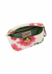 Funda de textura floral en crema con flores rosas y amarillas. Forro de tela verde con una etiqueta que dice "OILILY ¿ HABLAS ALEGRÍA?"
