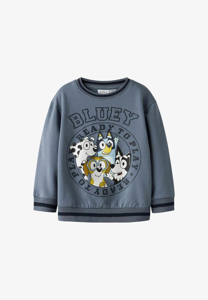 Felpa grigia con stampa rotonda che presenta cani a cartoni animati e la scritta "BLUEY READY TO PLAY". Polsini e scollo a coste. Tessuto morbido, design casual.