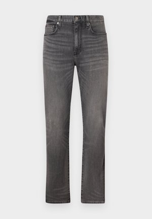 Jean en denim gris pour homme, coupe droite, avec bouton frontal, fermeture éclair et design à cinq poches, présenté sur fond blanc.