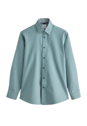 Chemise à manches longues bleu-vert clair avec un col boutonné, arborant un motif subtil et un détail de col intérieur contrastant. Cinq boutons sur le devant.