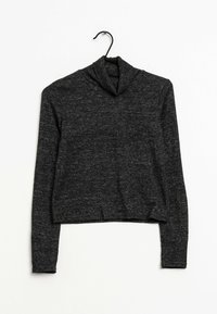 Schwarzer, verkürzter Rollkragenpullover mit langen Ärmeln. Hergestellt aus einem strukturierten Strickstoff, mit einer lockeren Passform und umgeschlagenem Kragen.