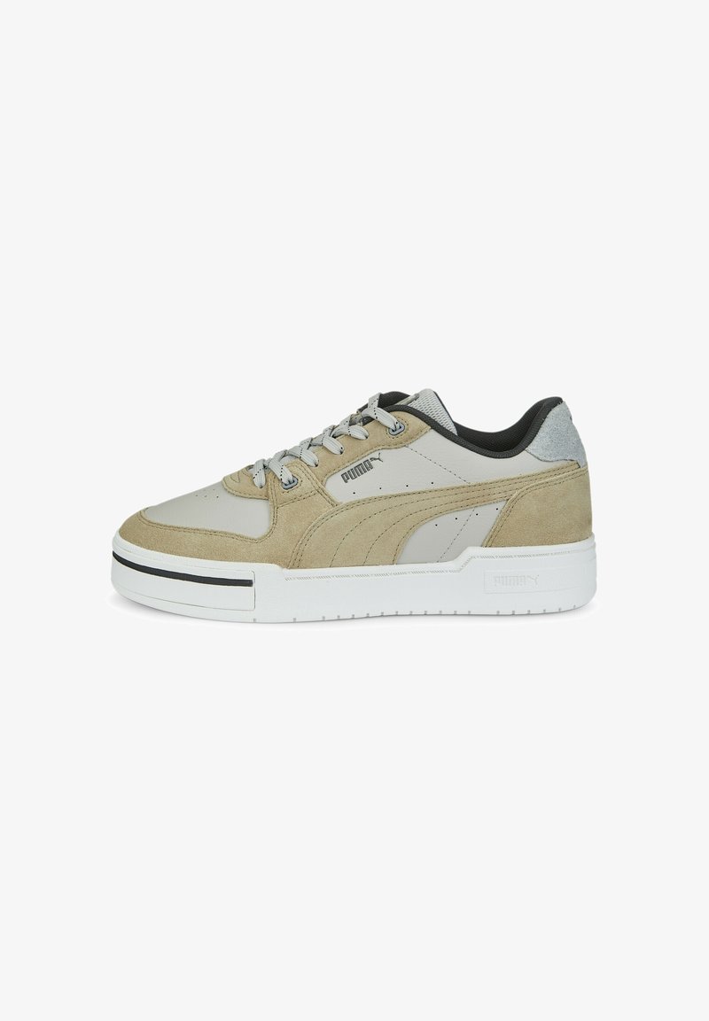 Light gray athletic shoe featuring a mix of smooth and suede materials, black accents, and a thick white sole with vertical ridges.