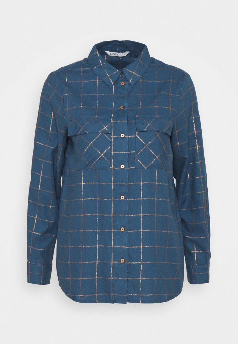 Blouse bleue à boutons avec manches longues, deux poches poitrine et motif quadrillé métallique doré sur toute la surface.