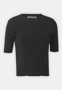 Black short-sleeve top made from textured fabric, featuring a round neckline and curved seam detailing on the front.