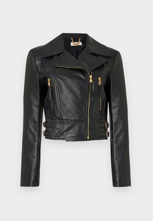 Must nahast lühike jakk asümmetriliste kuldsete lukkudega, kahe lukuga tasku, lai krae ja reguleeritavad küljekinnitusrihmad.