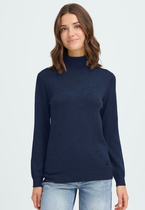 Mörkblå polotröja med långa ärmar, ribbad struktur och en liten logodetalj vid fållen. Tillverkad av ett mjukt, elastiskt material.