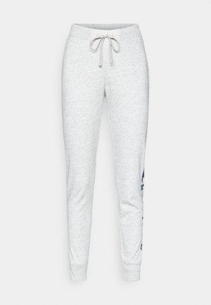 Pantalones jogger de algodón gris con cintura elástica y cordón, con piernas ajustadas y un estampado gráfico azul marino en el lado izquierdo.