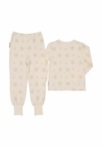 Beige pyjama-asut pitkähihasilla ja joustavilla hihansuilla, joissa on ohut apilakuosi koko ajan pehmeällä ja kevyellä kankaalla.