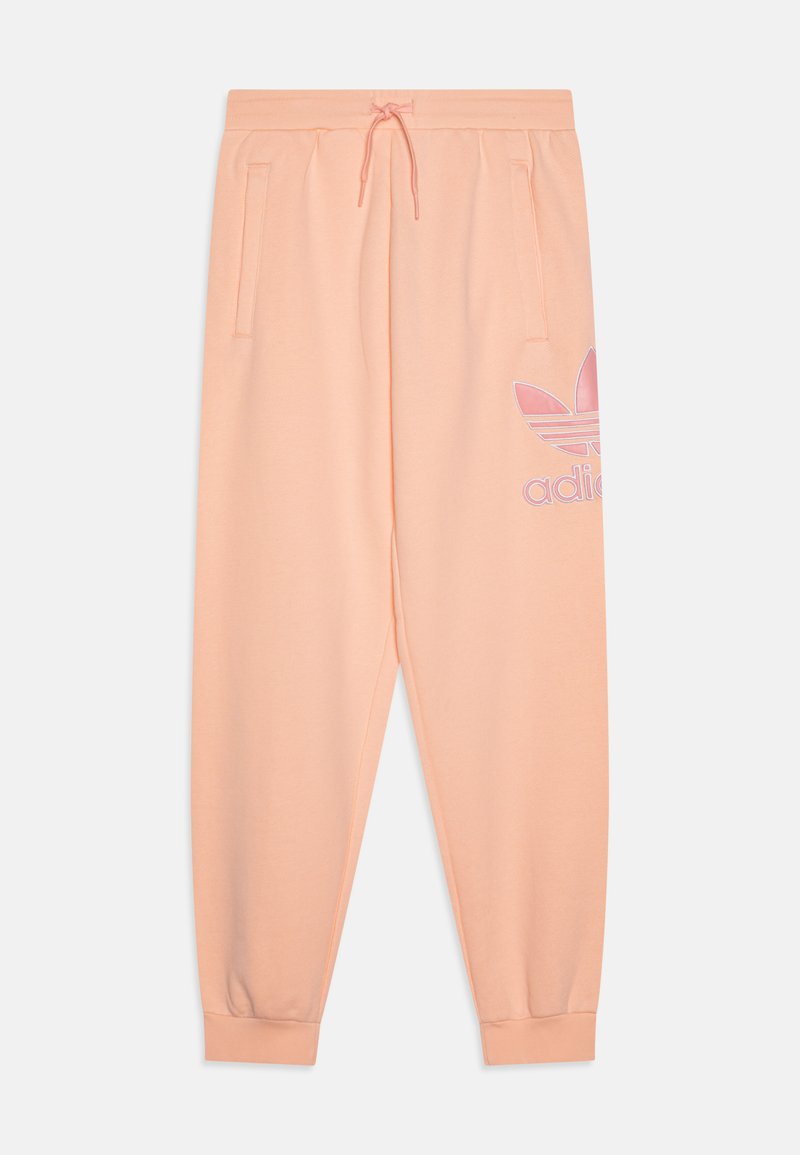 Vaaleanpunaiset fleece-housut, joissa on joustava vyötärö, kiristysnauha, sivutaskut ja brodattu logo. Koon mukaan kapeat lahkeet ja ribbaatut hihnat.