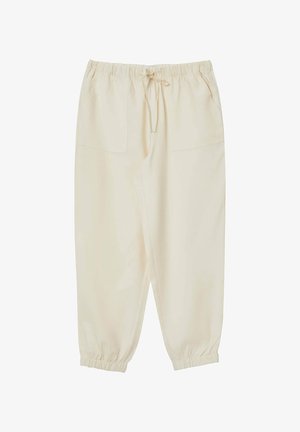 Cremefarbene, lässige Hose mit elastischem Bund und Kordelzug. Verfügt über zwei Fronttaschen und schmal zulaufende Bündchen. Glatte Textur.