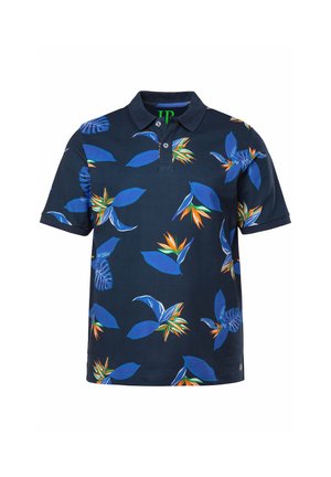 Polo in navy con un motivo floreale che presenta foglie blu e accenti arancioni. Realizzato in cotone, ha un colletto e maniche corte.