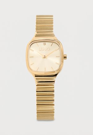 Reloj de pulsera Liu Jo en tono dorado con esfera cuadrada, dial minimalista, un solo cristal a las 12 en punto y correa metálica texturizada con eslabones.