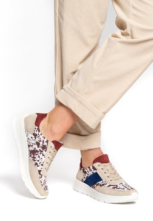 Sneakers featuring a speckled white and burgundy design, beige suede accents, navy stripe, and a cushioned white outsole.