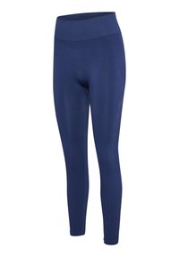 Granatowe, bezszwowe legginsy z wysokim stanem, o prążkowanej fakturze i długości do kostek.