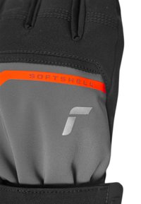 Svart och grå softshell-handske med en orange detalj och "SOFTSHELL" text, slät yta och en åtsittande design.