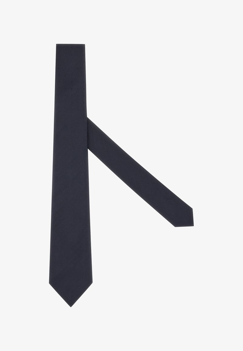 Tamsiai mėlynas kaklaraištis, pagamintas iš tekstūruotos medžiagos, su subtiliu taškų raštu, su smailiu galiuku ir siauru uodegos galu. Ilgainiui piešinys.