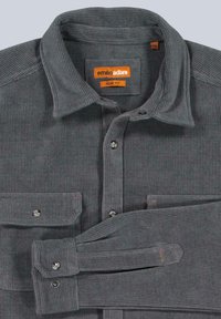 Gray corduroy shirt with a slim fit design, featuring a button-up front, two chest pockets, and contrasting orange accents on tags and cuff.
