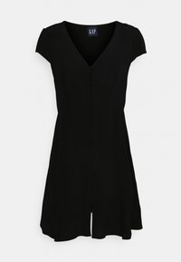 Musta lyhythihainen mekko V-pääntiellä, edessä napitettava yksityiskohta, hieman levenevä hameosa ja pieni halkio helmassa.