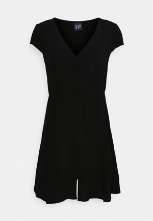 Svart klänning med kort ärm, V-ringning, knappknäppning fram, lätt utställd kjol och en liten slits framtill vid fållen.