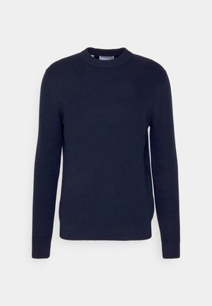 Pull en tricot bleu marine avec des manches longues, un col rond, des poignets et un ourlet côtelés, présentant un tissage texturé et une couleur unie.