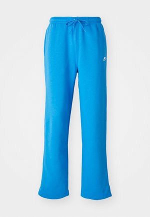 Blue sweatpants made of soft fabric, featuring a relaxed fit, elastic waistband with drawstring, and a small white logo on the left side.