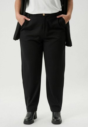 Black trousers with a tailored fit, featuring a button closure, side pockets, and a smooth texture. Worn with a white top and black boots.