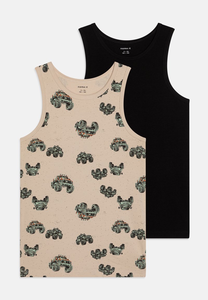 Two sleeveless tops: one beige with a truck graphic pattern and specks, the other solid black. Both are made from soft fabric.
