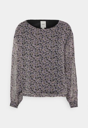 Blusa preta transparente com padrão floral em roxo e branco. Decote redondo, mangas longas com punhos franzidos e corte relaxado. Etiqueta visível.