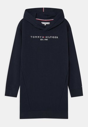 Robe sweat à capuche marine en tissu doux, dotée d'un grand logo, de poches avant et d'une capuche doublée avec des rayures sur le contour.